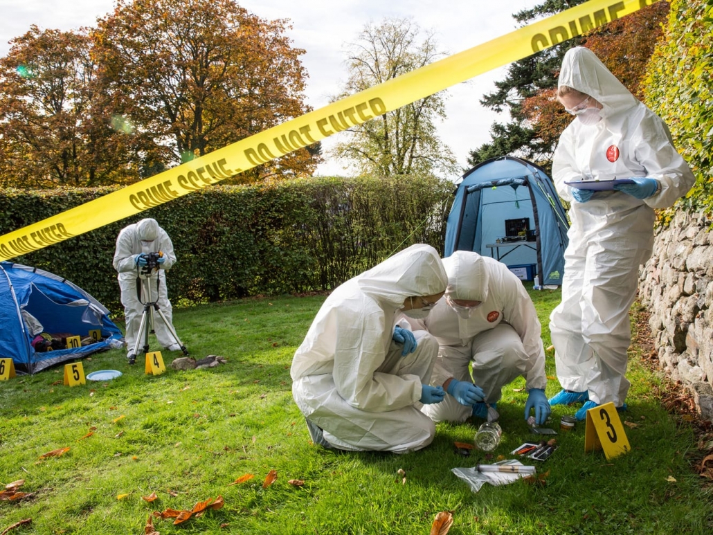 a group of people disinfecting crime scene.